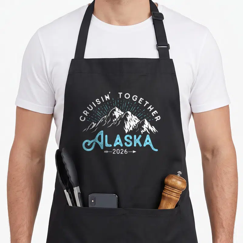 Alaska family aprons - Retro white and light blue mountain design with Cruisin Together Alaska 2026 text — shown on a black cotton canvas apron against a white background