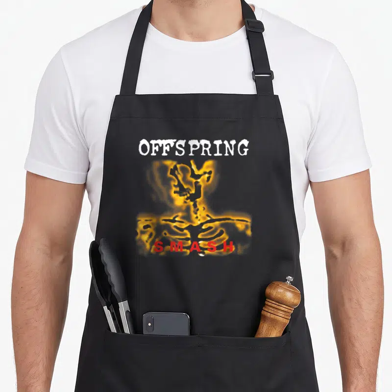 Offspring alternative apron - Glowing yellow skeleton torso with white Offspring text and red Smash lettering — shown on a black cotton canvas apron against a white background