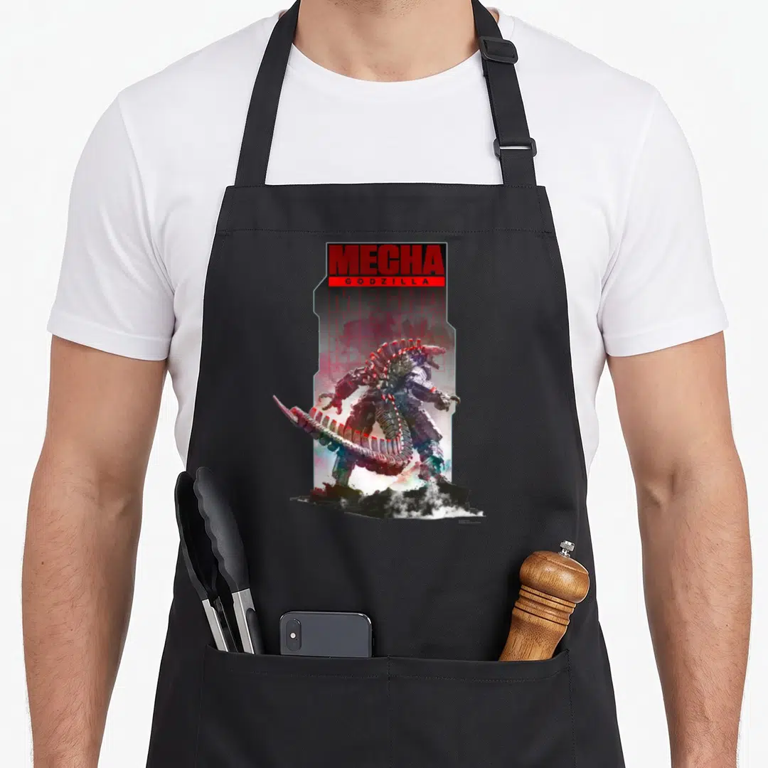 Mechagodzilla apex apron - MECHA GODZILLA text in red box above standing robot in watercolor red silver blue black — shown on a black cotton canvas apron against a white background