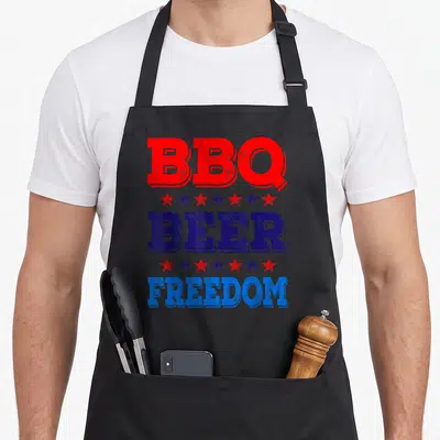 Summer 4th of july apron - Stacked red and blue text reading BBQ BEER FREEDOM separated by alternating star rows — shown on a black cotton canvas apron against a white background