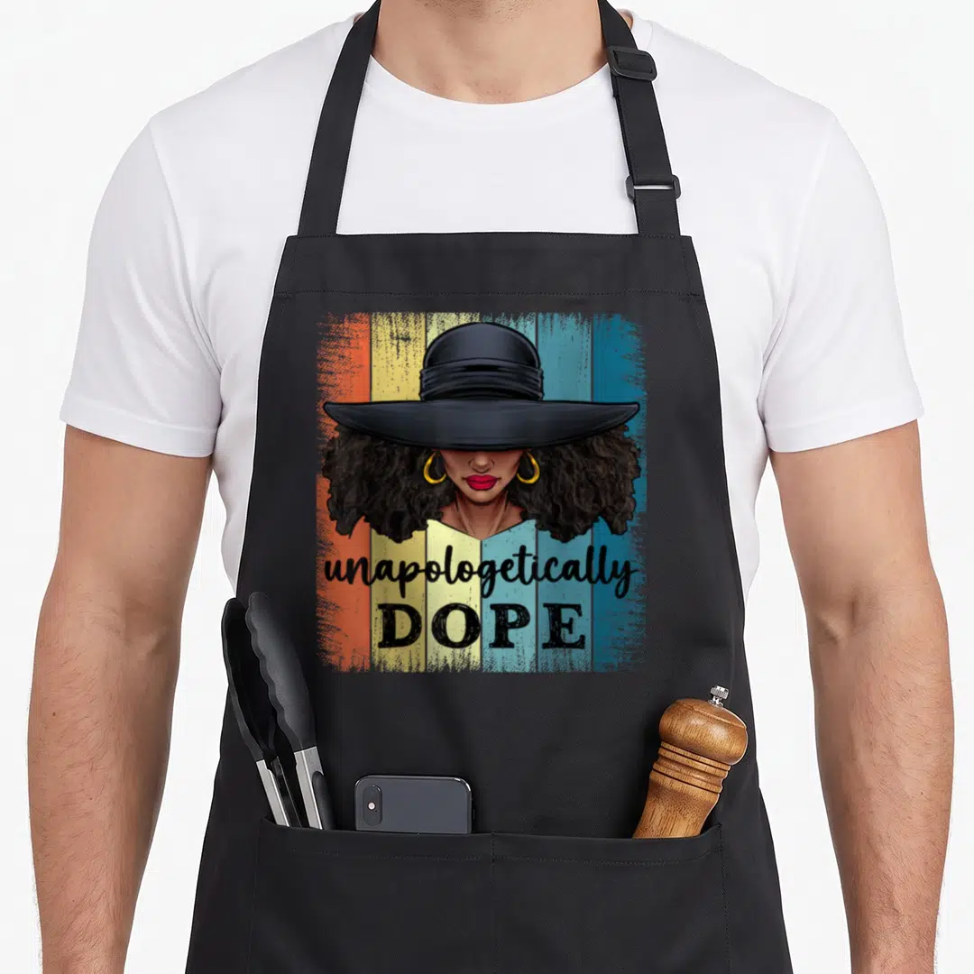 Dope african american aprons - Cartoon woman wide brim hat gold hoops red lips unapologetically DOPE striped background — shown on a black cotton canvas apron against a white background