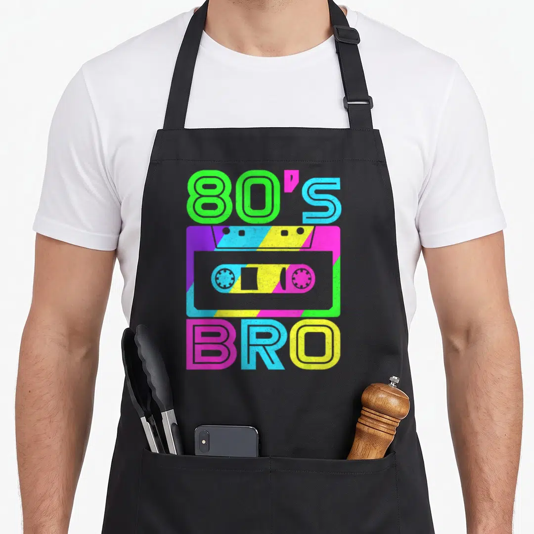Bro 80s apron - Neon cassette tape with 80'S BRO text on striped background — shown on a black cotton canvas apron against a white background