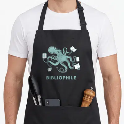 Octopus bibliophiles librarians apron - Muted teal line-art octopus surrounded by four white books with centered text — shown on a black cotton canvas apron against a white background