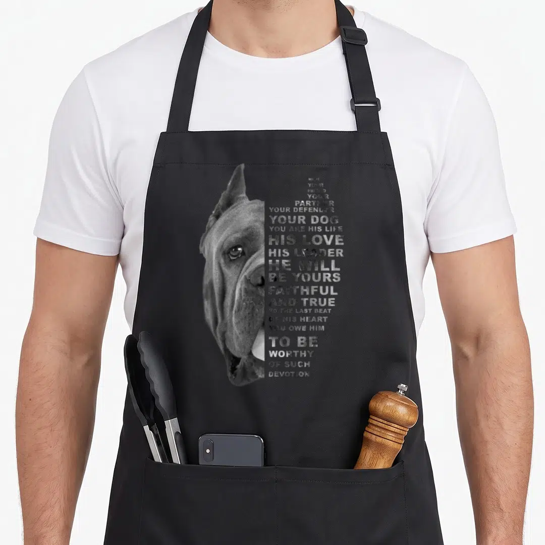 Friend cane apron - Grayscale Cane Corso head with vertical text about friendship and devotion on black background — shown on a black cotton canvas apron against a white background