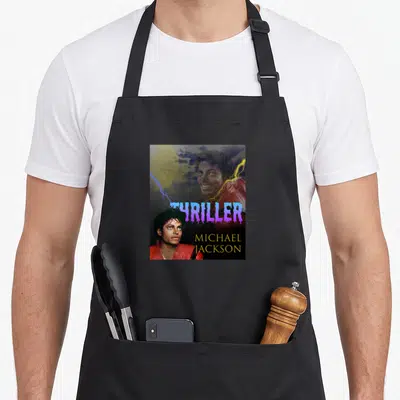 Vintage thriller michaels apron - Michael Jackson Thriller poster with purple dripping text, yellow moon, and lightning — shown on a black cotton canvas apron against a white background