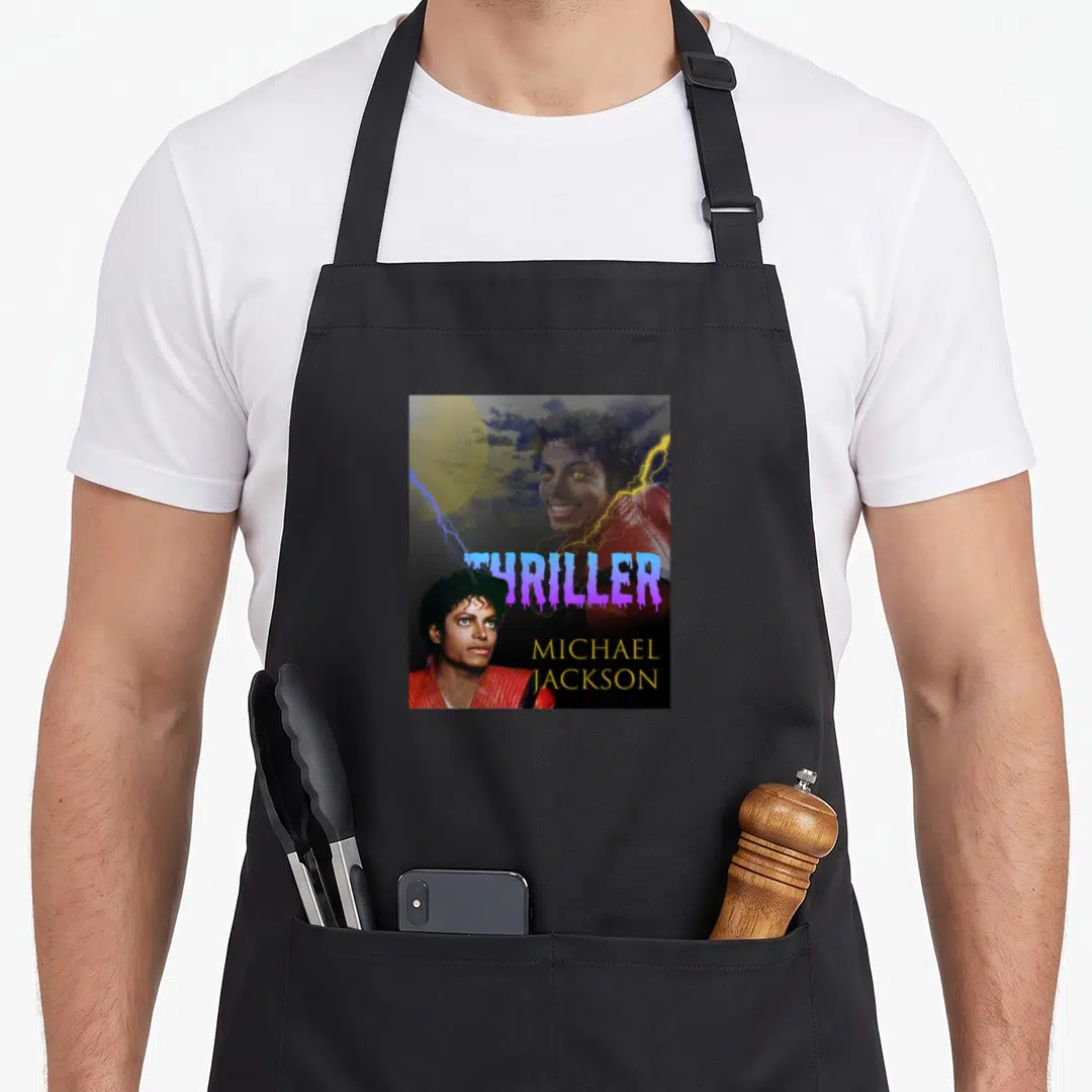 Vintage thriller michaels apron - Michael Jackson Thriller poster with purple dripping text, yellow moon, and lightning — shown on a black cotton canvas apron against a white background