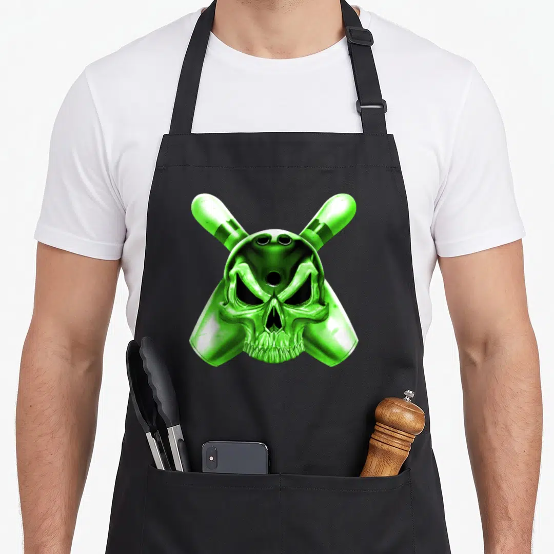 Bowling skull apron - Green cartoon skull centered over two crossed bowling pins in black and neon green — shown on a black cotton canvas apron against a white background