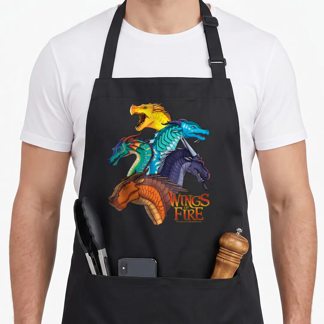 Wing fire dragon apron - Five dragon heads stacked vertically with Wings of Fire logo in stylized font — shown on a black cotton canvas apron against a white background