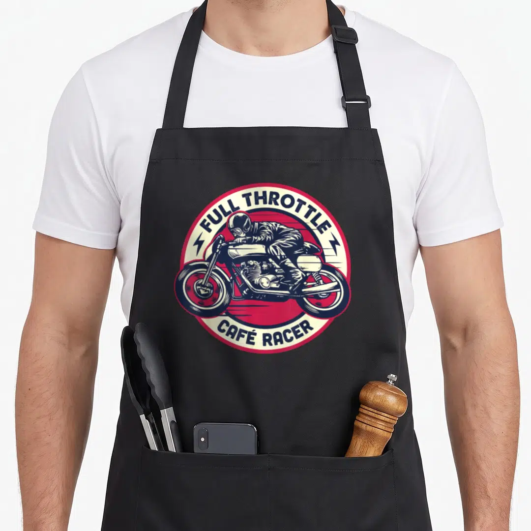 Racer motorcycle apron - Retro circular emblem with motorcyclist and full throttle café racer text in blue red and cream — shown on a black cotton canvas apron against a white background