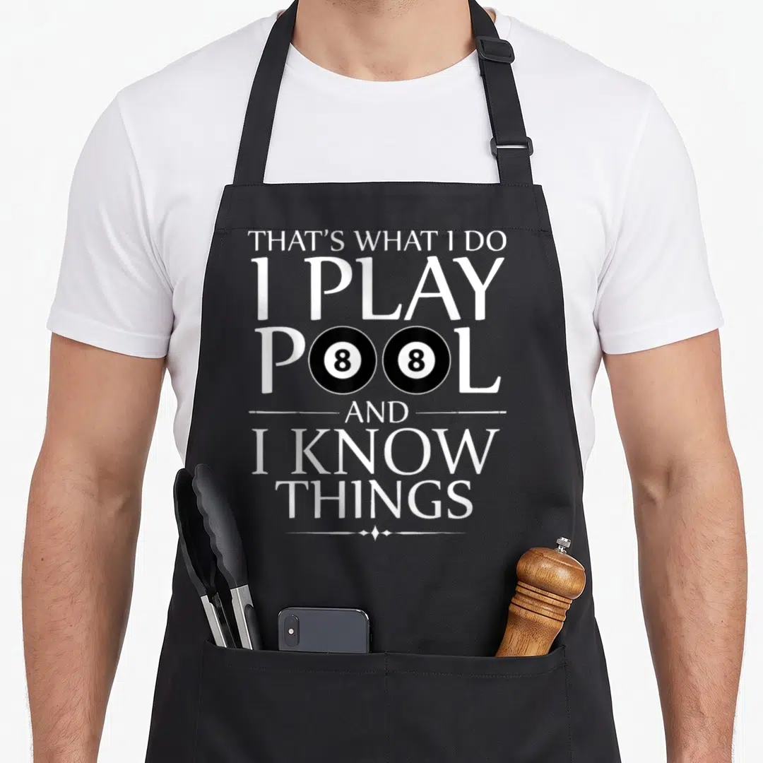Play pool billiards apron - Stacked white text that's what i do i play pool and i know things with two 8-balls — shown on a black cotton canvas apron against a white background