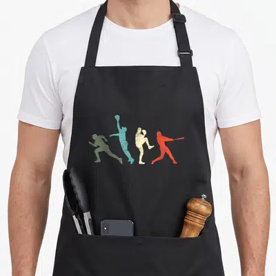 Catcher pitcher baseball apron - Four distressed athlete silhouettes in green blue beige and red arranged horizontally — shown on a black cotton canvas apron against a white background
