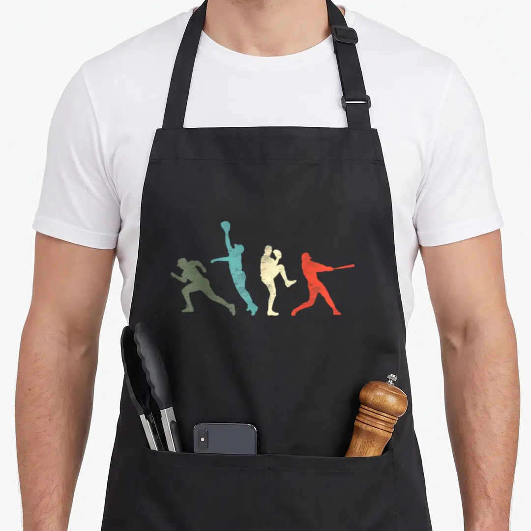 Catcher pitcher baseball apron - Four distressed athlete silhouettes in green blue beige and red arranged horizontally — shown on a black cotton canvas apron against a white background
