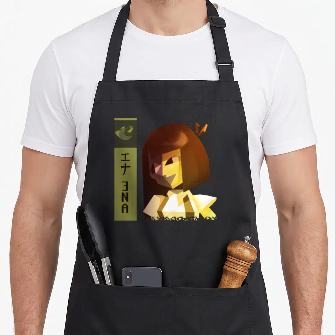 Funny ena novelty apron - Pixel art character Ena with vertical olive rectangle and Japanese text — shown on a black cotton canvas apron against a white background
