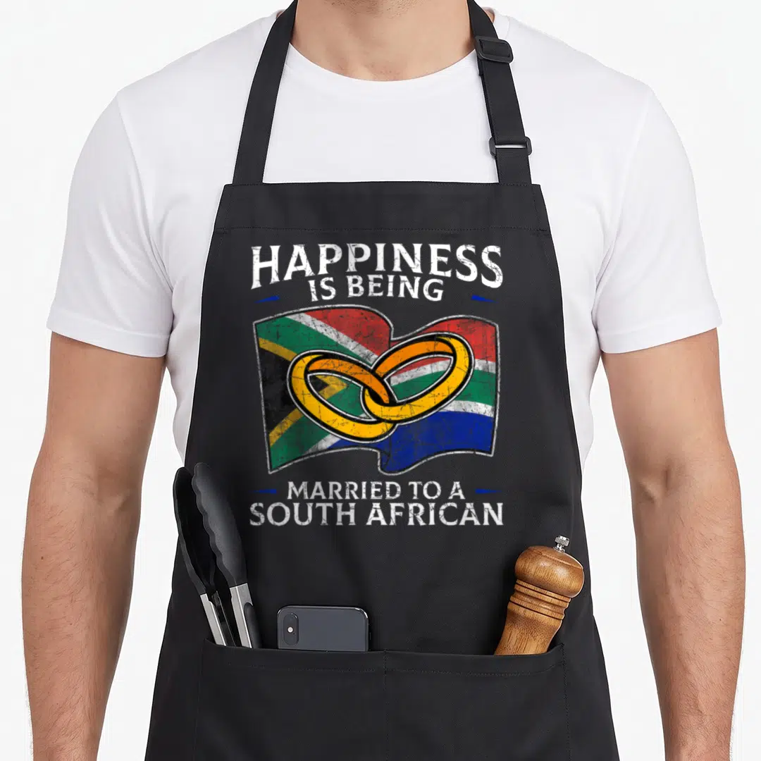 Wedding south african apron - Distressed text and two interlocking rings over a waving multicolor flag — shown on a black cotton canvas apron against a white background