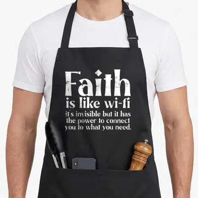 Wifi christian aprons - White stacked typography reading Faith is like wi-fi on a grey background — shown on a black cotton canvas apron against a white background