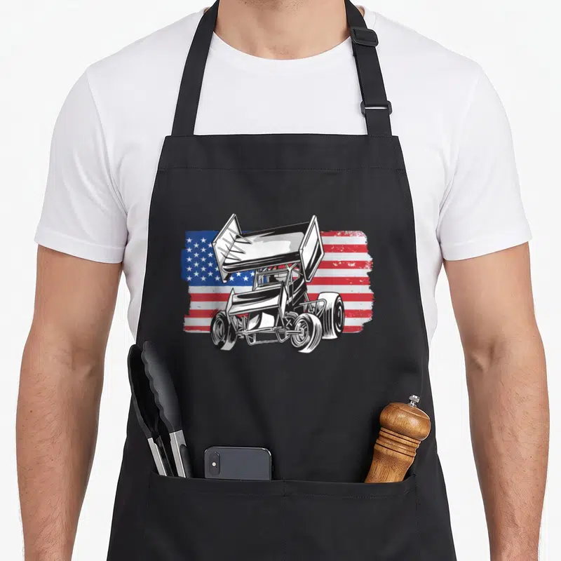 Sprint car racing apron - Line art sprint car over distressed red white blue USA flag — shown on a black cotton canvas apron against a white background