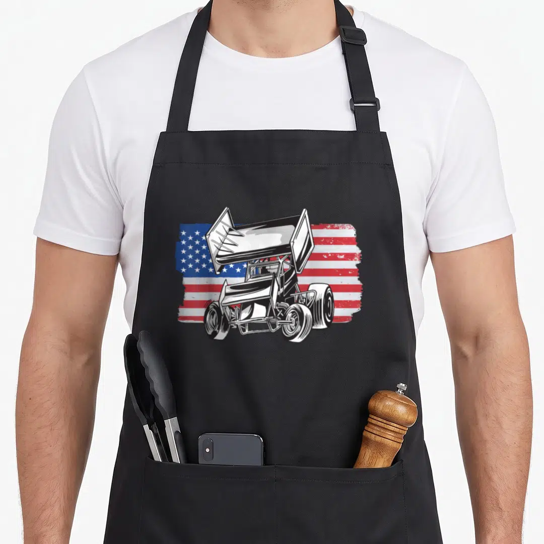 Sprint car racing apron - Line art sprint car over distressed red white blue USA flag — shown on a black cotton canvas apron against a white background