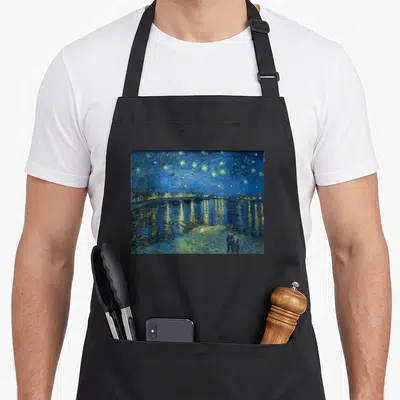 Rhone van gogh apron - Night sky landscape with dark blue stars, yellow reflections, and two figures by a river — shown on a black cotton canvas apron against a white background