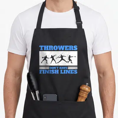 Finish track apron - Blue text THROWERS DON'T HAVE FINISH LINES surrounding four grey athlete silhouettes on white — shown on a black cotton canvas apron against a white background