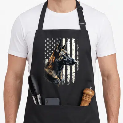 Malinois dog american flag apron - Realistic Belgian Malinois head profile over distressed white flag with stars — shown on a black cotton canvas apron against a white background