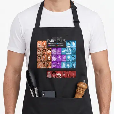 Princess table apron - Periodic Table of Fairy Tales grid with princess prince friends and villain portraits in peach — shown on a black cotton canvas apron against a white background