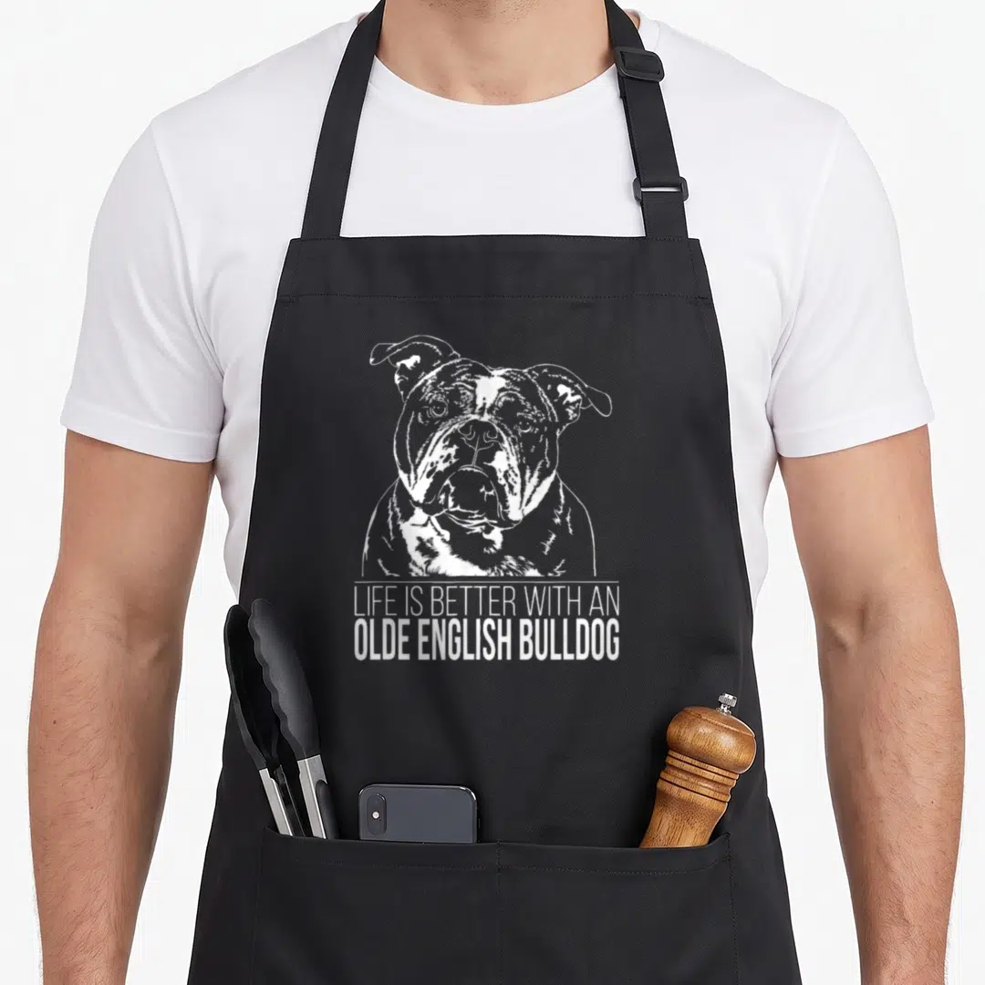 Olde english chef aprons - White line-art Olde English Bulldog head above text LIFE IS BETTER WITH AN OLDE ENGLISH — shown on a black cotton canvas apron against a white background