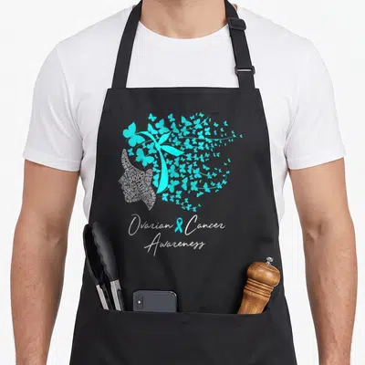 Ovarian butterfly apron - Teal ribbon surrounded by teal butterflies, one filled with white advocacy text and bottom — shown on a black cotton canvas apron against a white background