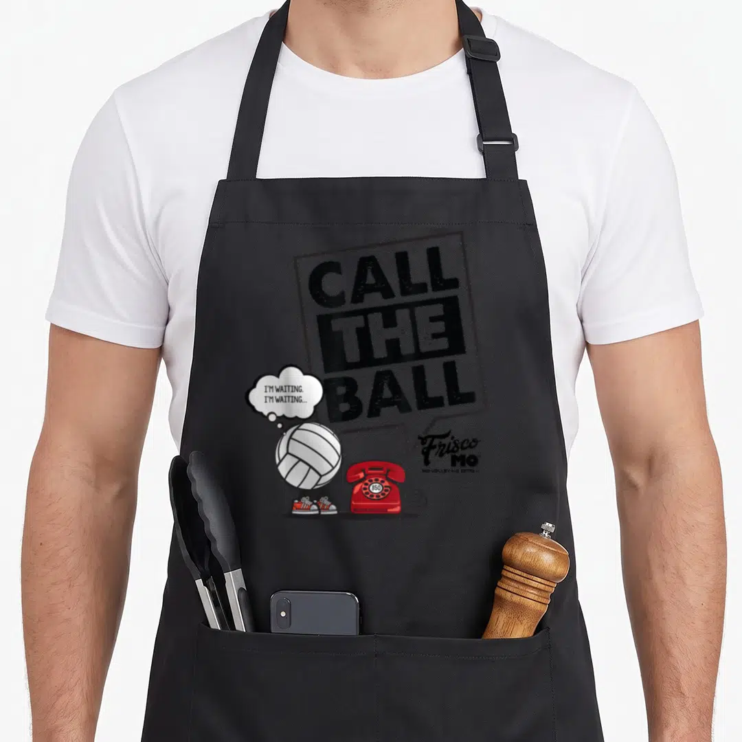 Call volleyball apron - Call The Ball text, red phone, cartoon volleyball with shoes, Frisco Mo logo — shown on a black cotton canvas apron against a white background