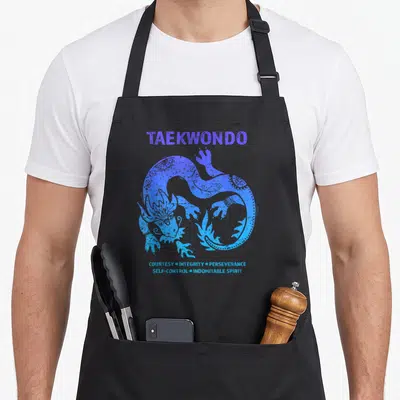 Tkd dragon apron - Blue and purple distressed dragon with Taekwondo five tenets text — shown on a black cotton canvas apron against a white background