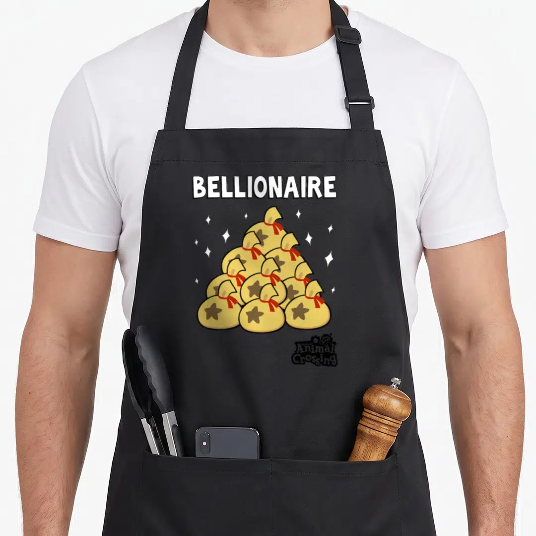 Bellionaire novelty apron - Yellow money bag pyramid with BELLIONAIRE text and scattered white stars — shown on a black cotton canvas apron against a white background