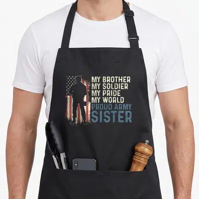 Brother army apron - Soldier silhouette beside distressed flag with My Brother My Soldier My Pride My World Proud Army — shown on a black cotton canvas apron against a white background