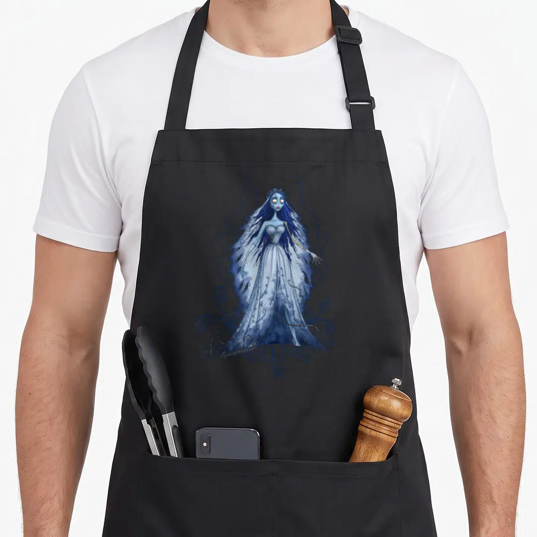 Corpse bride apron - Blue and white cartoon bride surrounded by swirling vines on black fabric — shown on a black cotton canvas apron against a white background