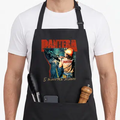 Pantera minute apron - Miner photo with red Pantera text and gold 5 Minutes Alone lettering — shown on a black cotton canvas apron against a white background