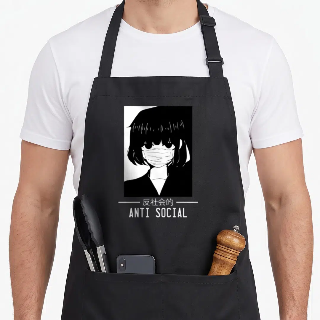 Anti japanese anime apron - Black and white masked anime character with anti social text and kanji below — shown on a black cotton canvas apron against a white background