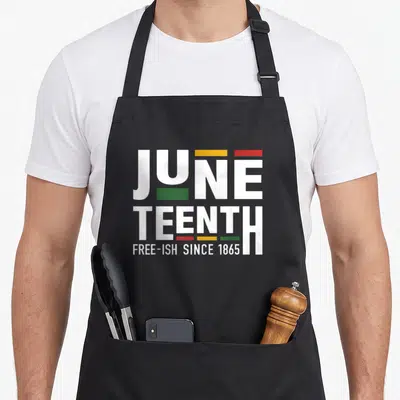 Juneteenth freeish african apron - White JUNE TEENTH FREE-ISH SINCE 1865 text with red yellow green rectangles — shown on a black cotton canvas apron against a white background