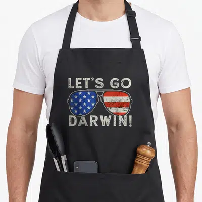 Aviator american flag apron - Sunglasses with US flag lenses and text Let's Go Darwin in distressed font — shown on a black cotton canvas apron against a white background