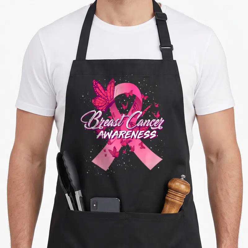Vintage breast cancer awareness aprons - Pink ribbon with magenta butterflies and white text reading Breast Cancer — shown on a black cotton canvas apron against a white background