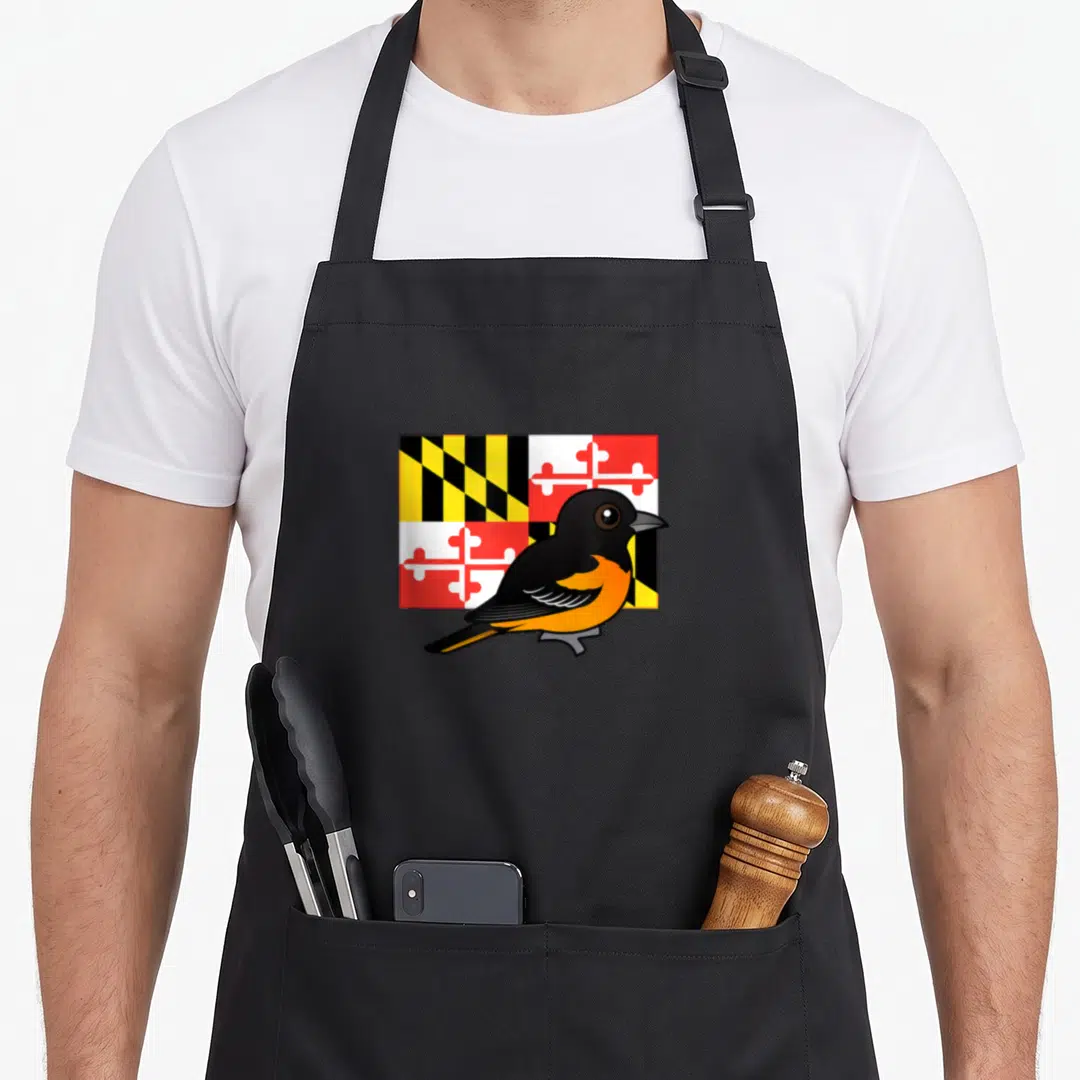 State birdorable apron - Cartoon Baltimore Oriole overlapping Maryland state flag in black, yellow, red, orange — shown on a black cotton canvas apron against a white background