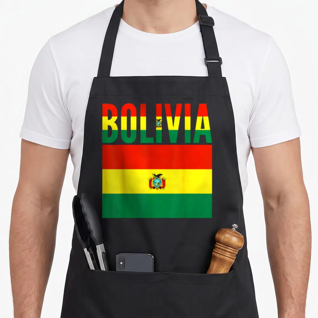 Bolivia country apron - BOLIVIA text filled with red yellow green stripes above rectangular flag with coat of arms — shown on a black cotton canvas apron against a white background