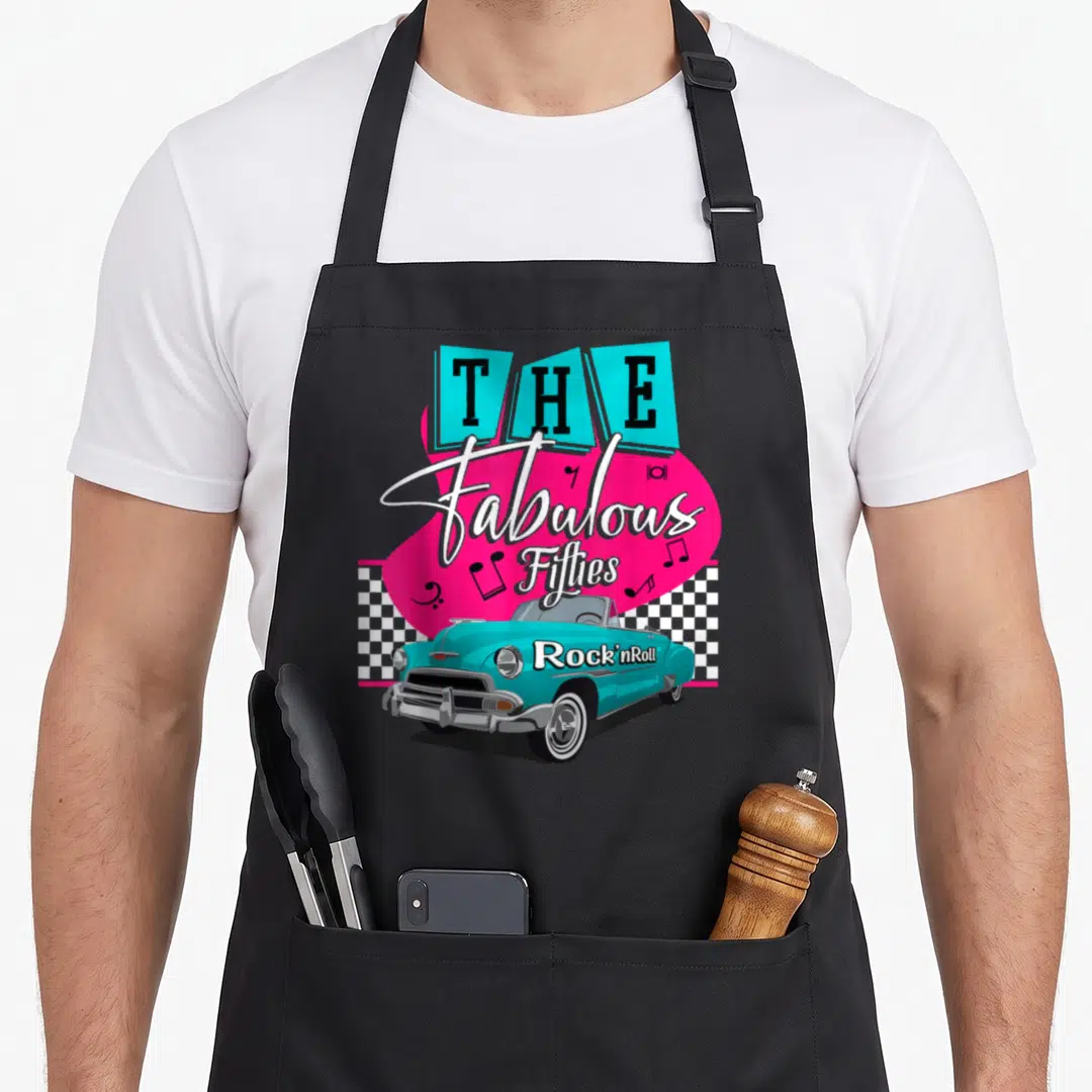 50s hip aprons - The Fabulous Fifties Rock nRoll text with turquoise car and pink graphic on checkerboard background — shown on a black cotton canvas apron against a white background