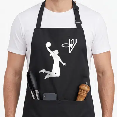 Retro basketball apron - White silhouette of female basketball player jumping to shoot ball into hoop — shown on a black cotton canvas apron against a white background