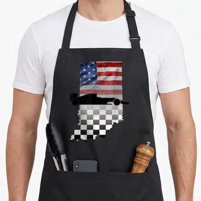Indiana american flag apron - Black race car silhouette over Indiana map with US flag top and checkered flag bottom — shown on a black cotton canvas apron against a white background