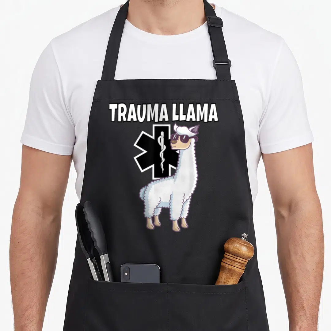 Trauma emt apron - Cartoon llama in sunglasses standing before a black Star of Life with white text above — shown on a black cotton canvas apron against a white background