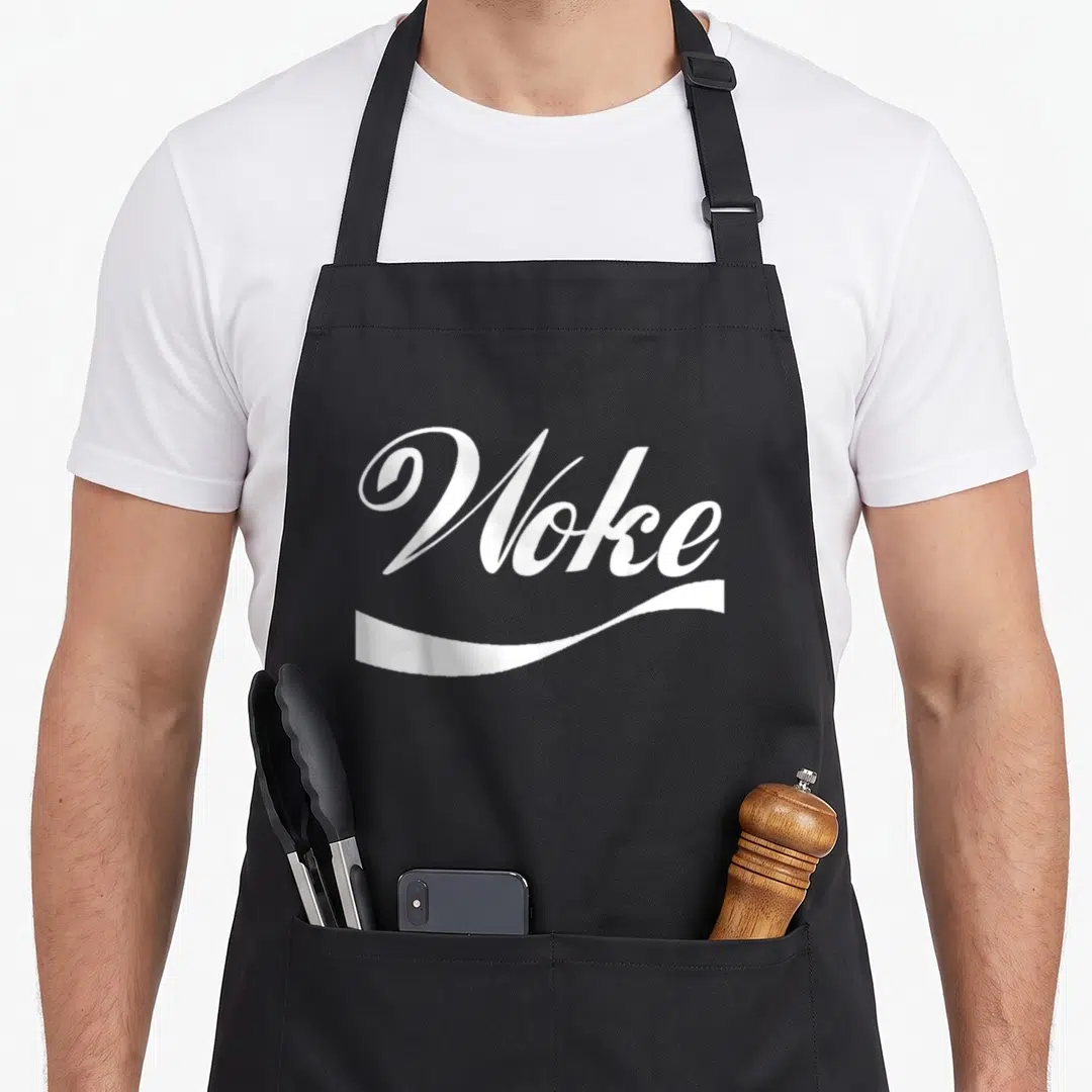 Woke stay apron - White Woke text and swoosh on black bib apron — shown on a black cotton canvas apron against a white background