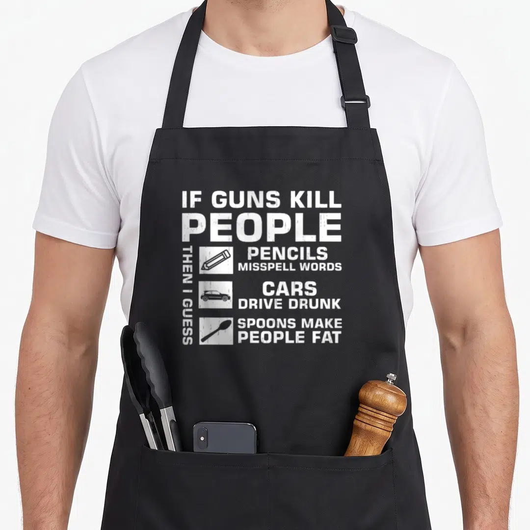 Then gun apron - White stacked text reading If Guns Kill People Then I Guess Pencils Misspell Words Cars Drive Drunk — shown on a black cotton canvas apron against a white background