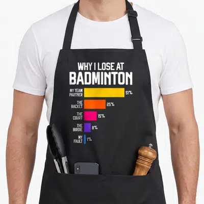 Lose badminton apron - Bar chart listing badminton loss excuses with colored bars for partner, racket, and court — shown on a black cotton canvas apron against a white background