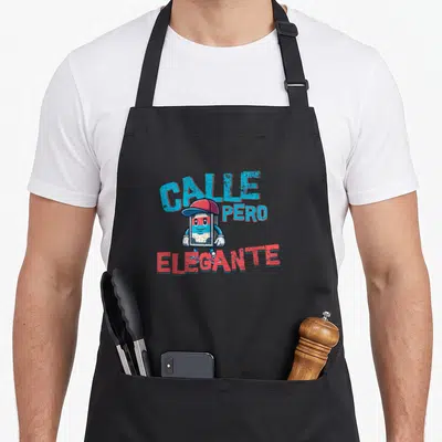 Reggaeton 90s apron - Cartoon cassette character with red cap and shoes surrounded by blue and red text CALLE PERO — shown on a black cotton canvas apron against a white background