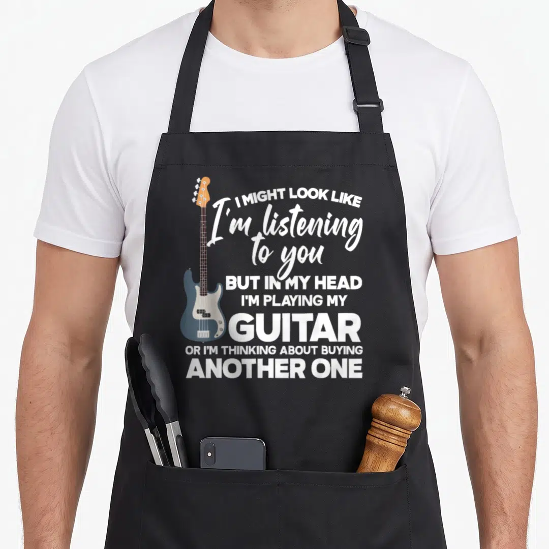 Funny guitarist playing guitar apron - Blue electric bass guitar next to white stacked text about listening and buying — shown on a black cotton canvas apron against a white background