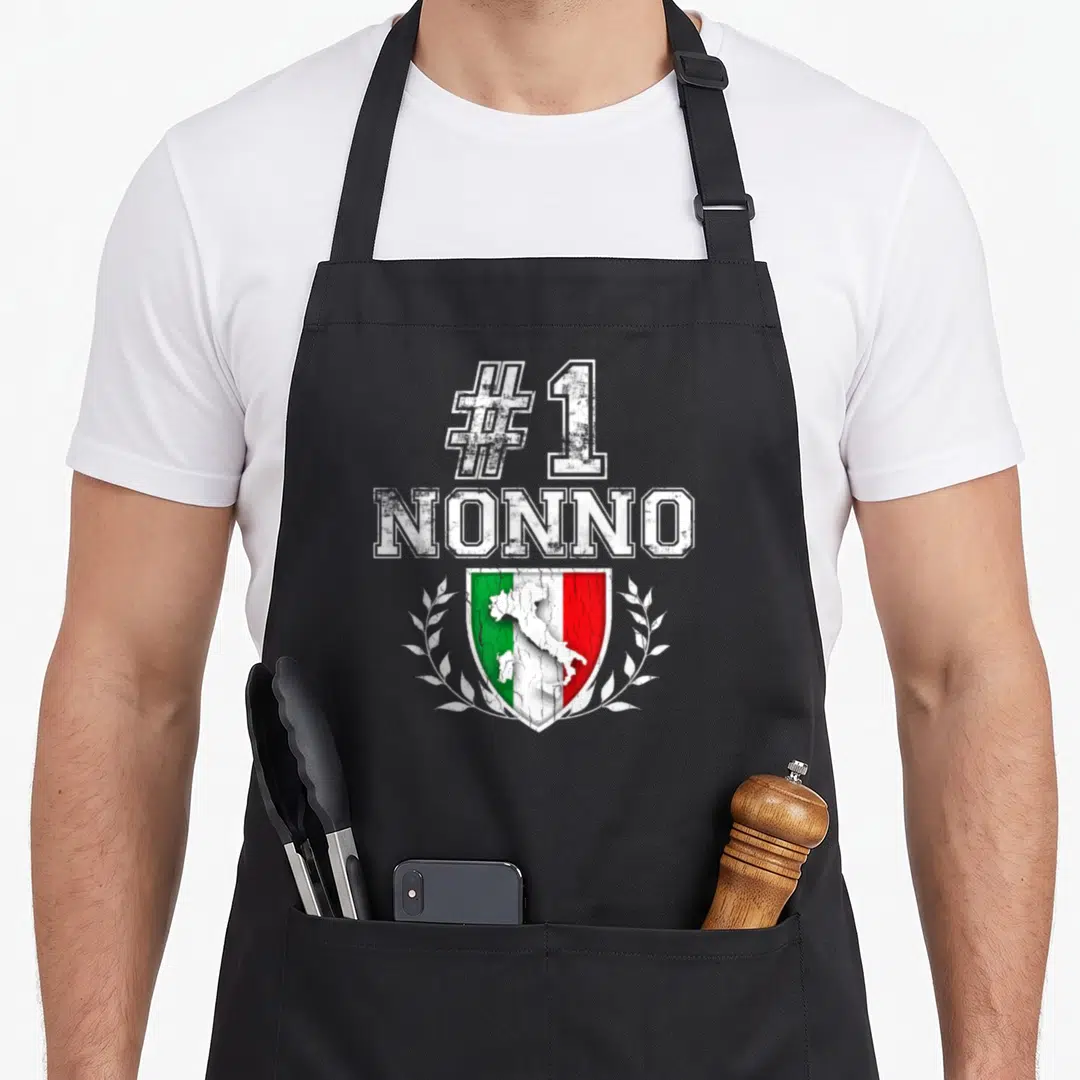 Number italian apron - #1 NONNO text above Italian flag shield with map and laurel wreath in distressed style — shown on a black cotton canvas apron against a white background