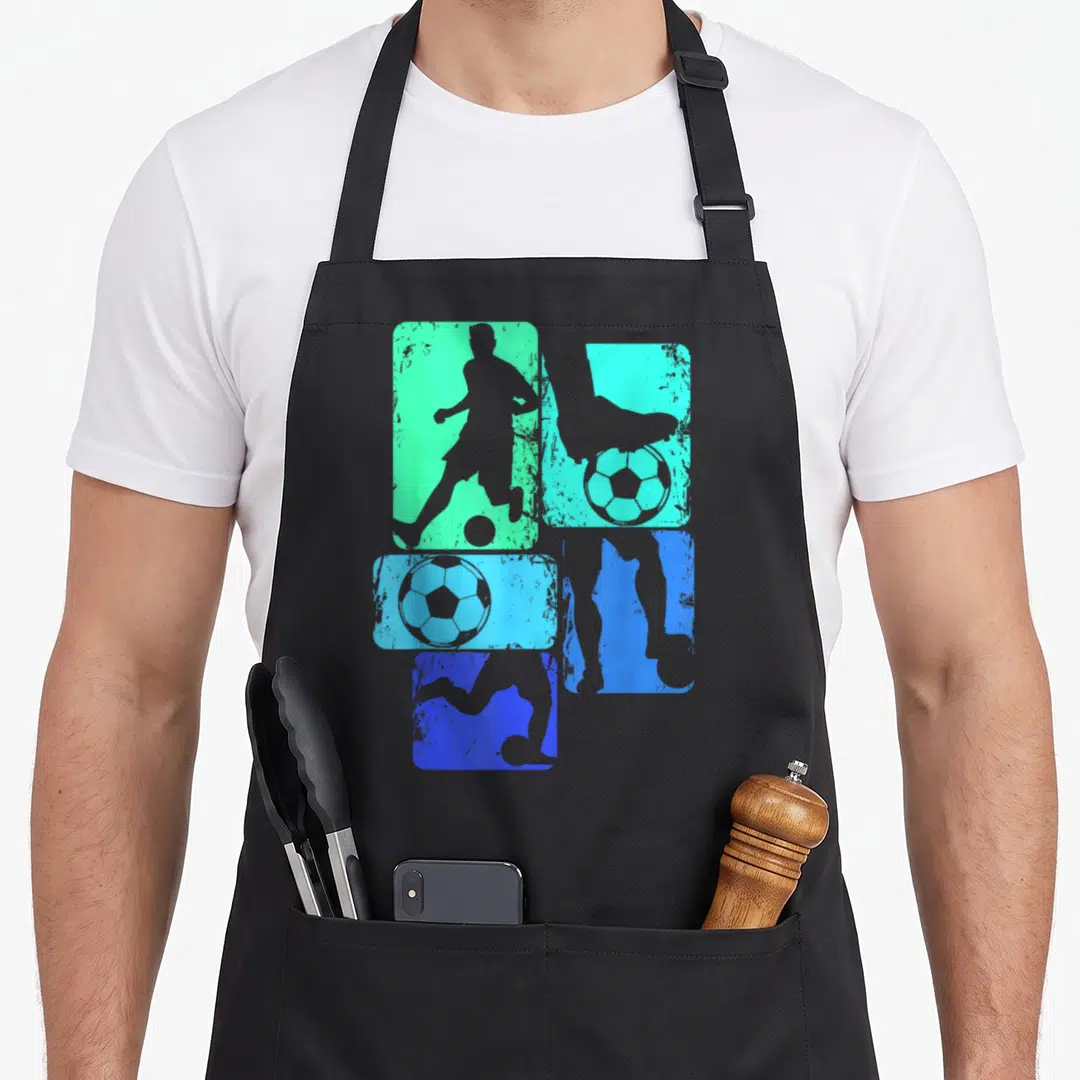 Player youth soccer apron - Four gradient rectangles in green and blue containing grey soccer player and ball — shown on a black cotton canvas apron against a white background
